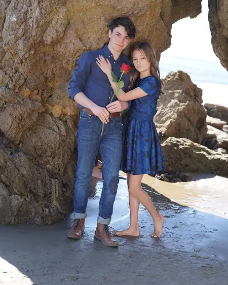 Sophie Fergi with now ex-boyfriend Jentzen Ramirez holding a rose at the beach on Valentine's Day.