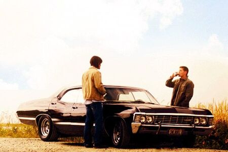Sam and Dean Winchester with their beloved impala.