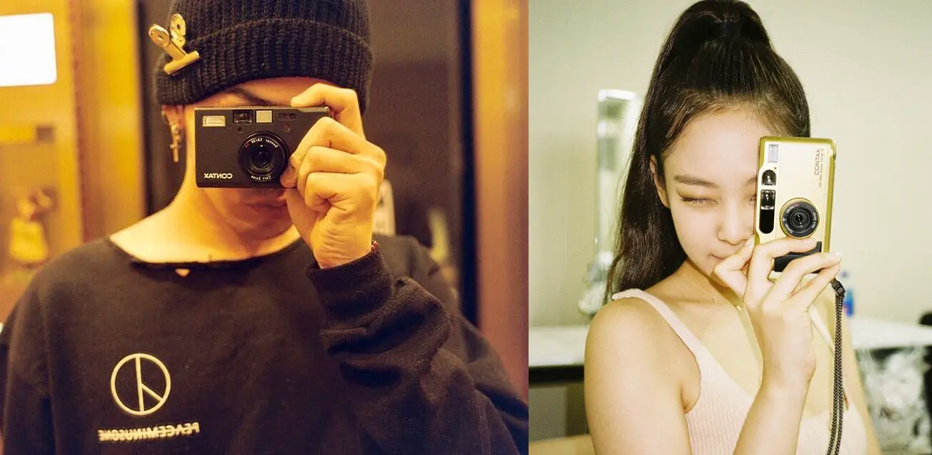 K-Pop's new rumored but almost confirmed couple, G-Dragon and Jennie Kim, side by side with their cameras up.